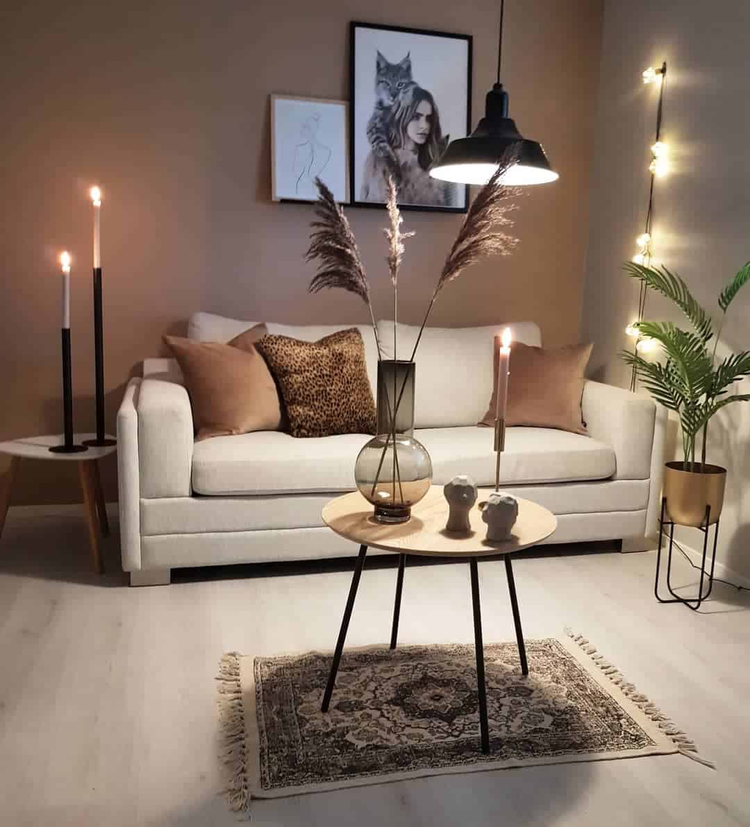 brown accent wall gray couch candles 