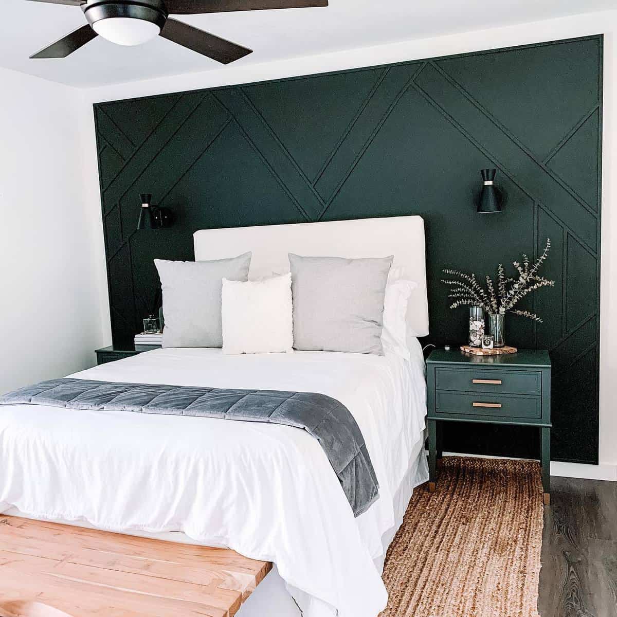 green accent wall bedroom green bedside table sconces lights wood bench 