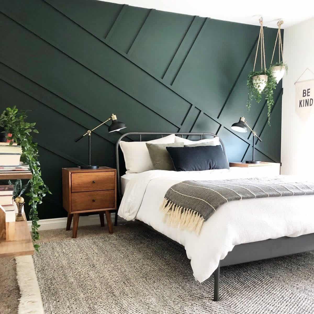 modern bedroom green accent wall gray bed frame hanging pot plants wood bedside table 