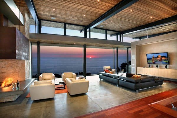 luxury open living room with fireplace and ocean view