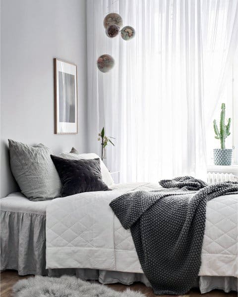 scandinavian small gray master bedroom with cactus
