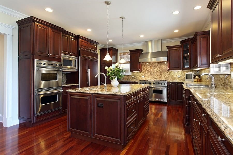 traditional brown kitchen with hardwood floor and polished granite countertops 