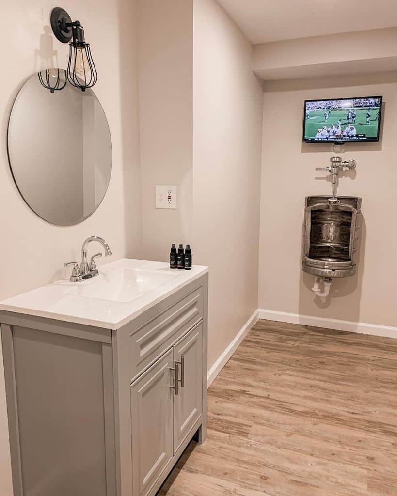urinal in modern bathroom with tv