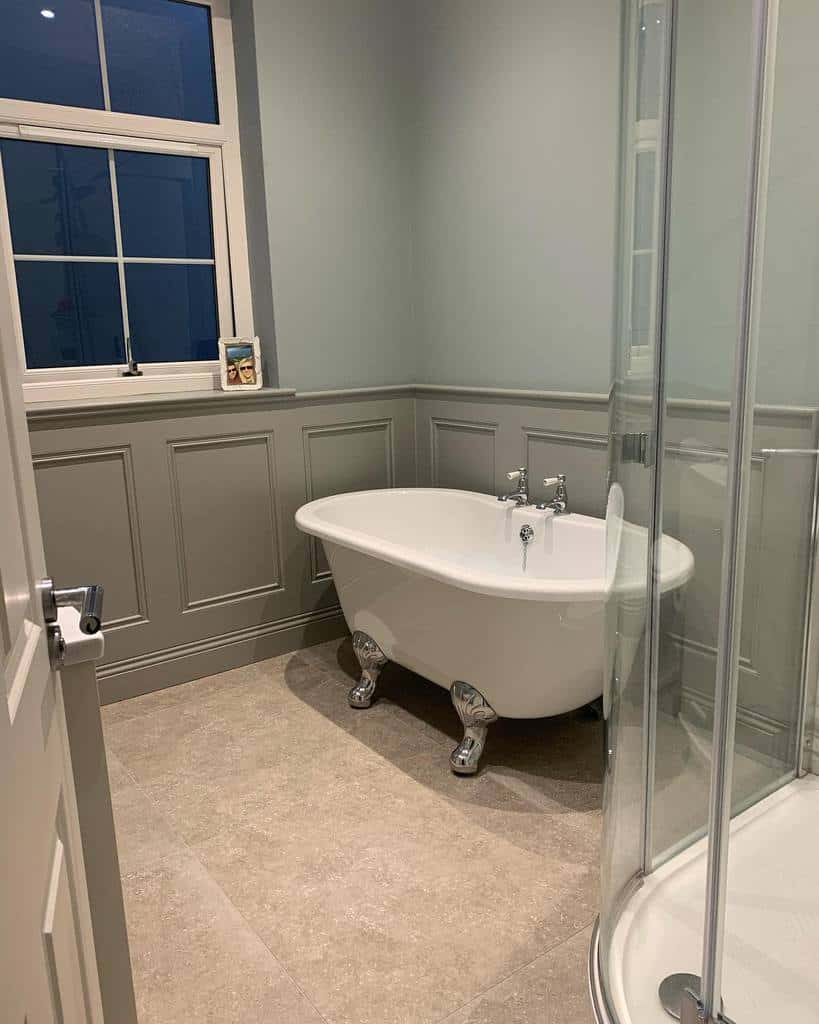 bathroom gray wall paneling freestanding bath shower 