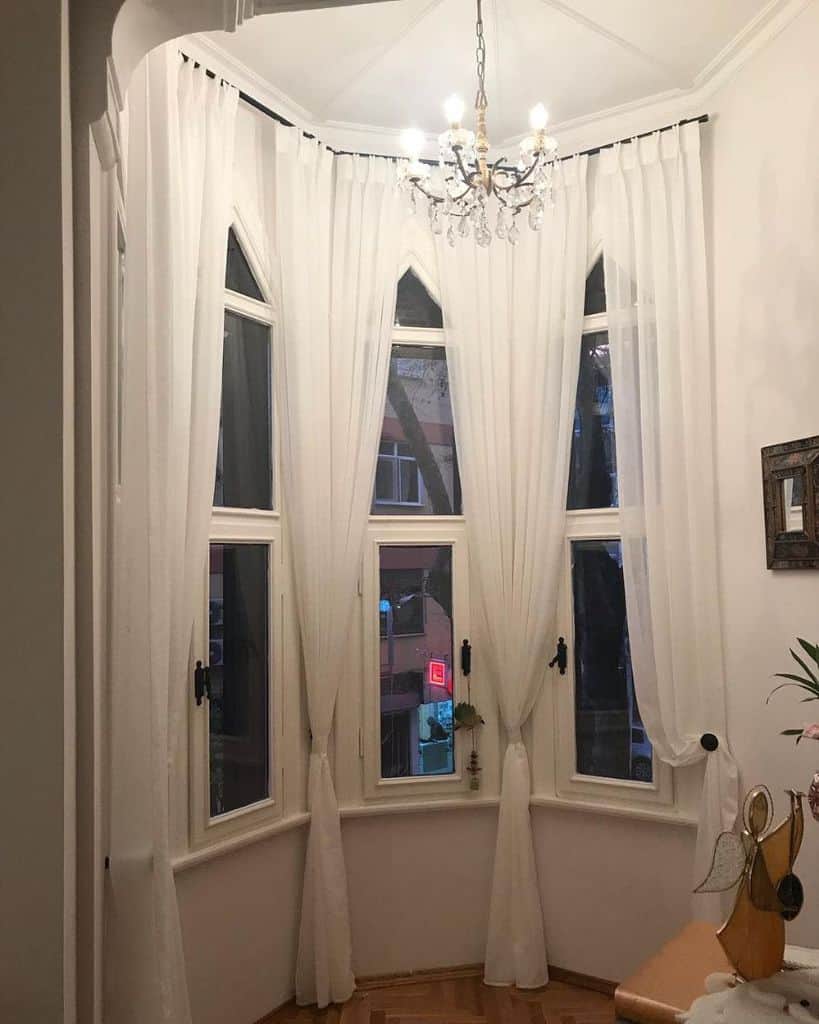 bay window living room white curtains