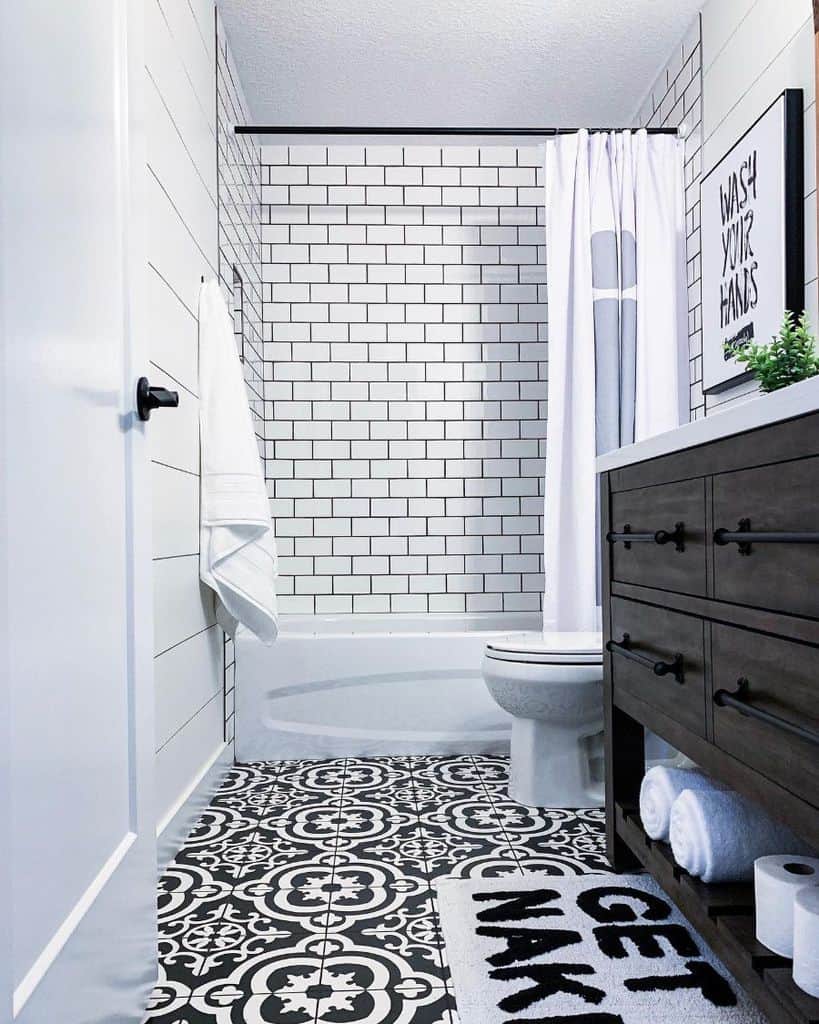 simple black and white bathroom with tub
