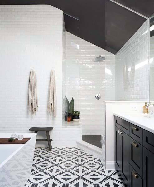 large modern bathroom walk-in shower black and white pattern floor tiles