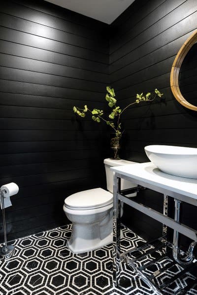 black shiplap wall powder room with white tub