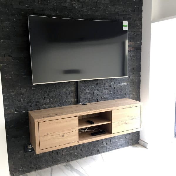 Black Stone Tile Wall With Wood Free Floating Stand Television Wall Ideas