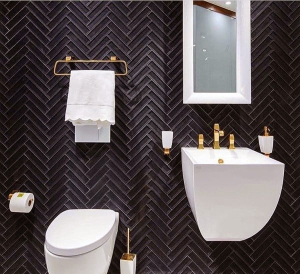 black tile bathroom white vanity gold accents