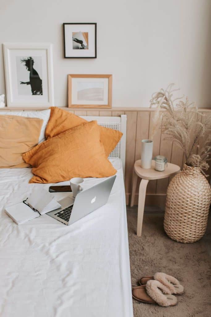 minimalist boho bedroom mac orange pillows 