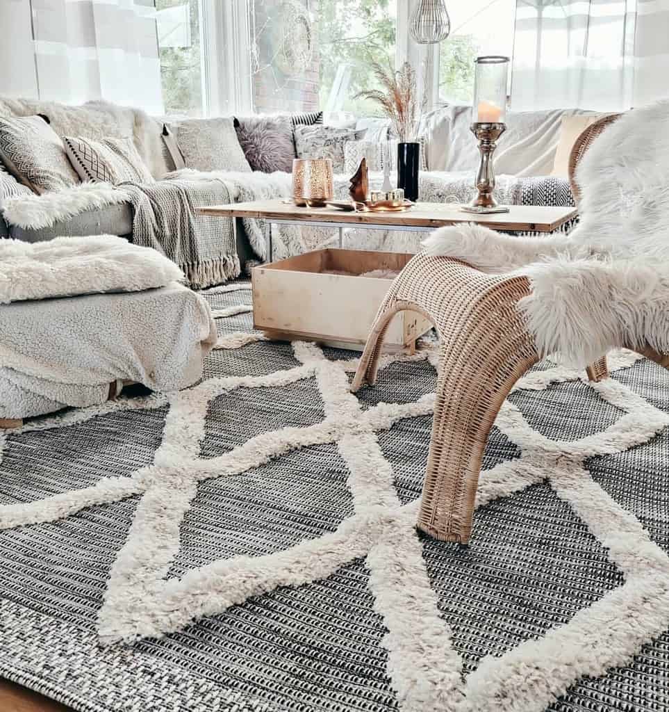 boho living room wicket chair sofa with throw rugs and pillows 