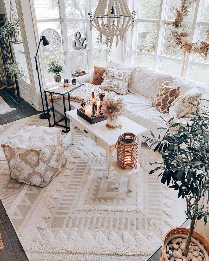 boho living room white sofa pattern footrest white coffee table candles black floor lamp 