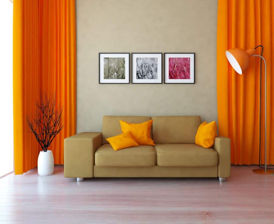 orange curtains and beige sofa living room