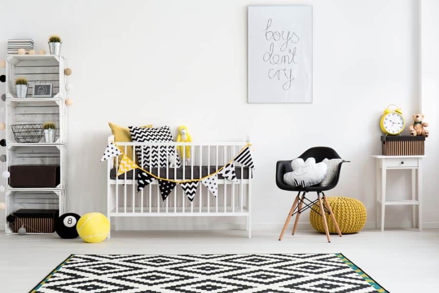black, white, and yellow baby boy's room