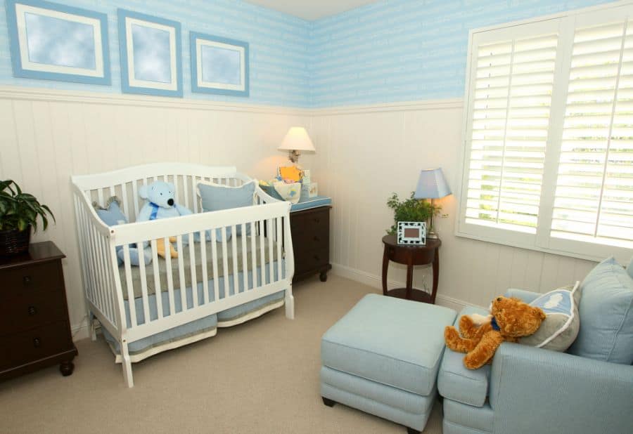 baby boy's room with blue couch