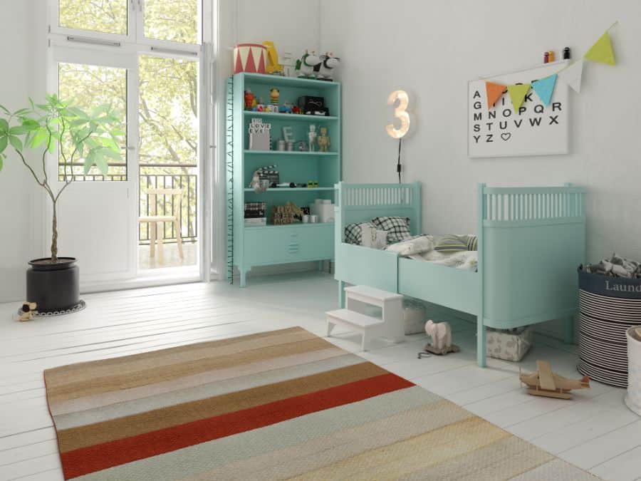 baby boy's room with cupboards and bed