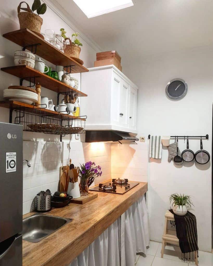 small kitchen floating shelves wood countertop white cabinets 