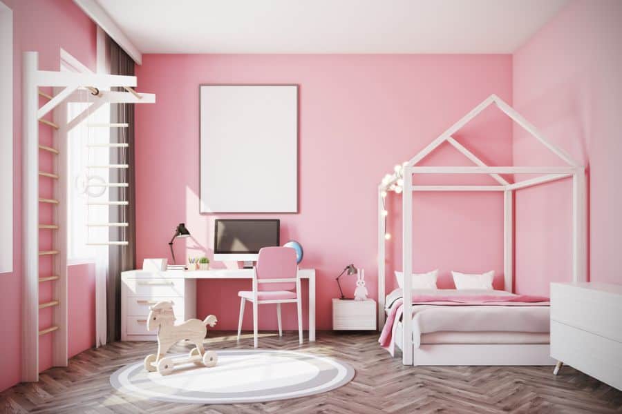 pink bedroom four post bed white desk