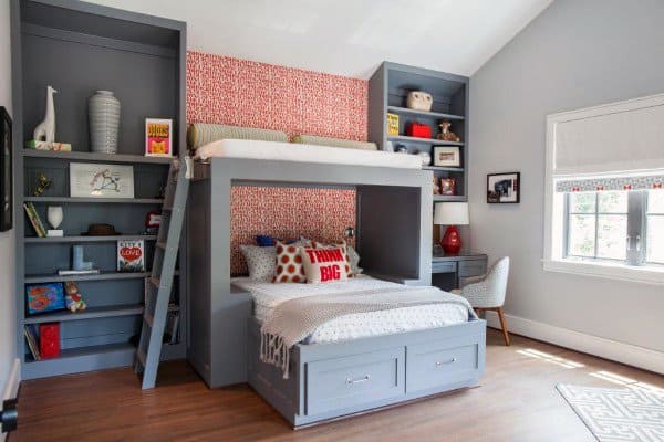 kids bed with seating above and built in storage cupbaords