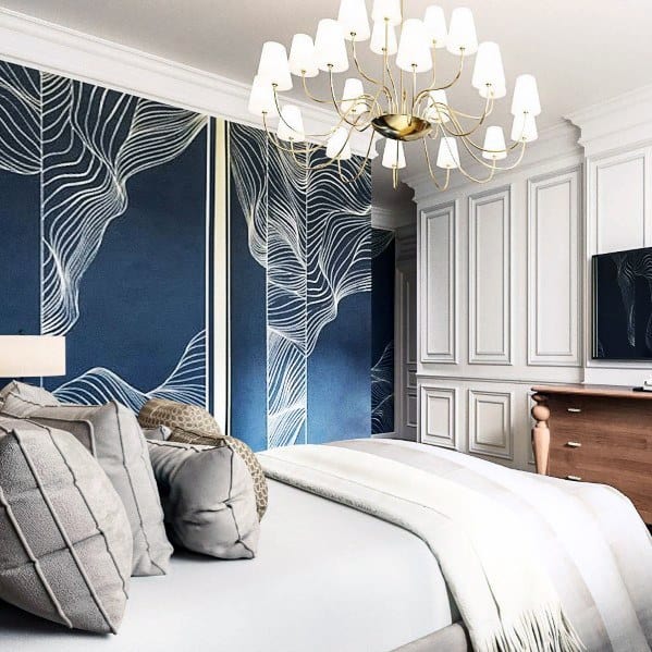 blue pattern wallpaper gray bed chandelier
