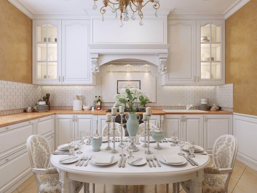 elegant white kitchen white dining table pattern fabric chairs white tile splashback