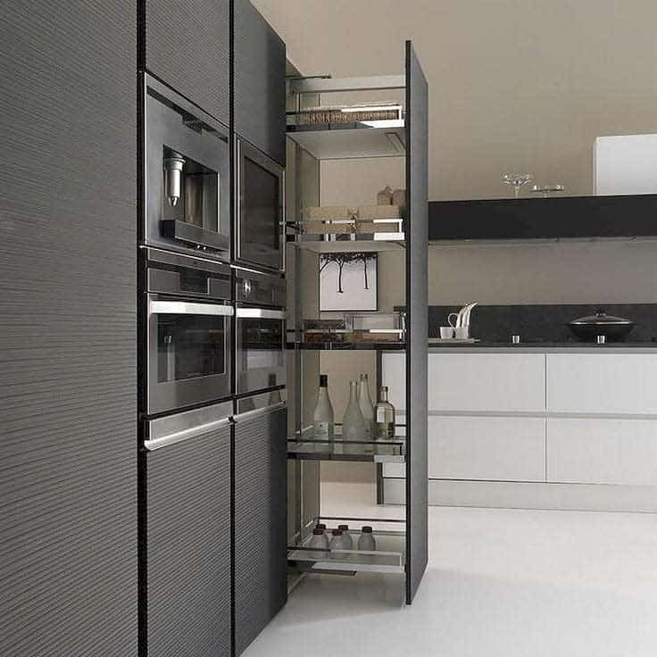 modern kitchen with built-in cupboards and four ovens 