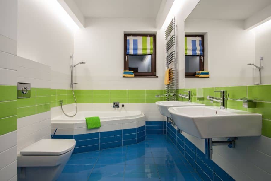 green white and blue tile kids bathroom dual sinks shower/bath