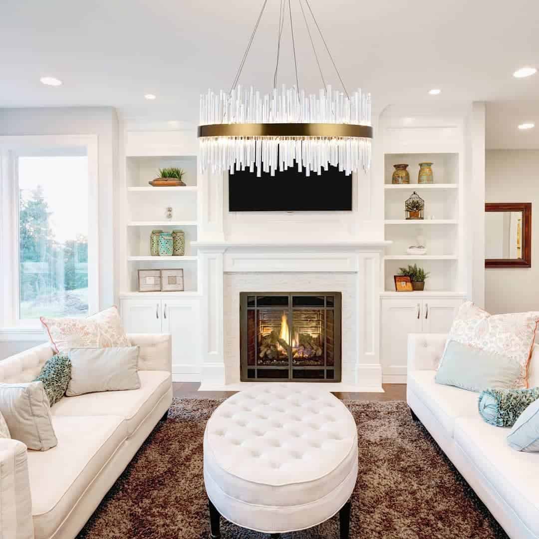 white luxury living room fireplace and dual sofas