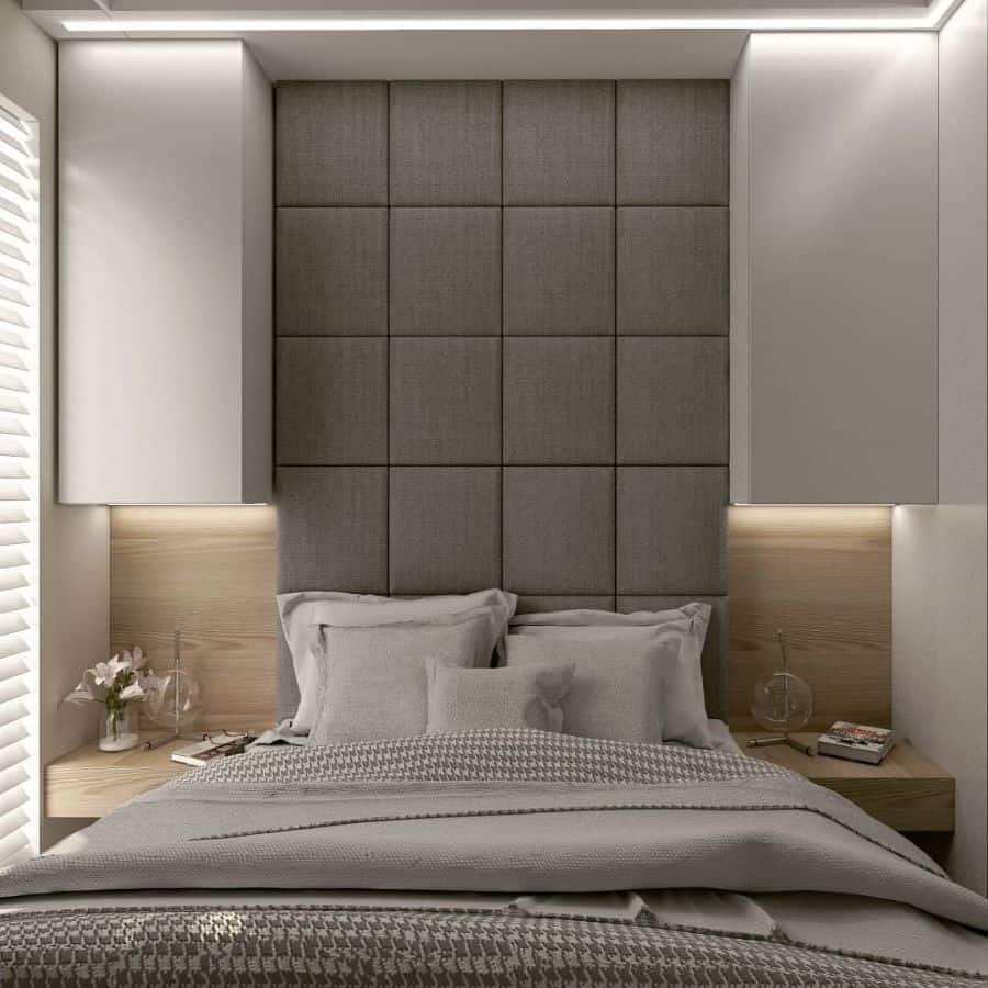 contemporary small bedroom with gray cushion headboard 