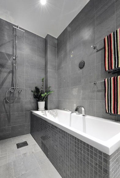 show and bath in gray tile bathroom