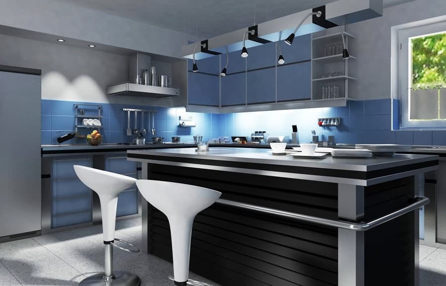 modern blue and gray kitchen with black island and two white stools 