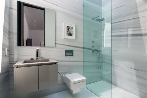 open doorless shower in gray marble wall bathroom 
