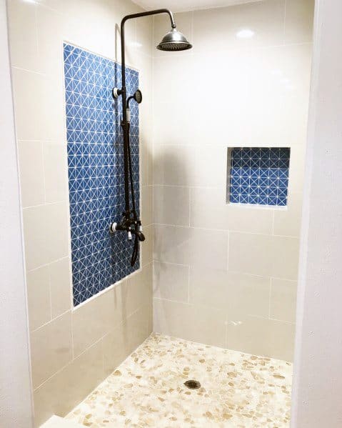 white shower with blue tiles