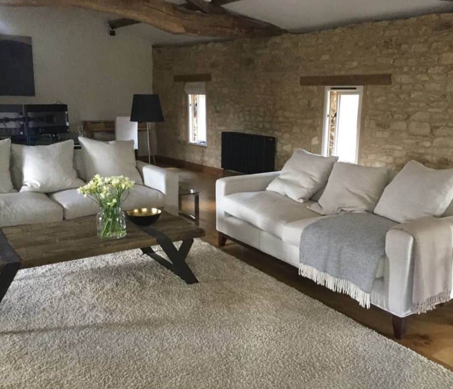 stone cabin living room white sofa wood coffee table 