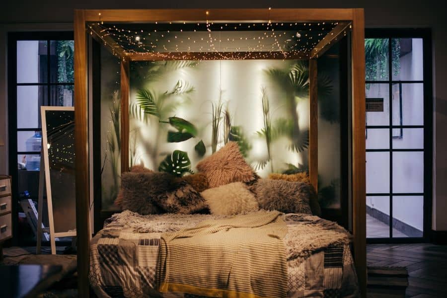 cozy boho bedroom plant silhouette platform bed