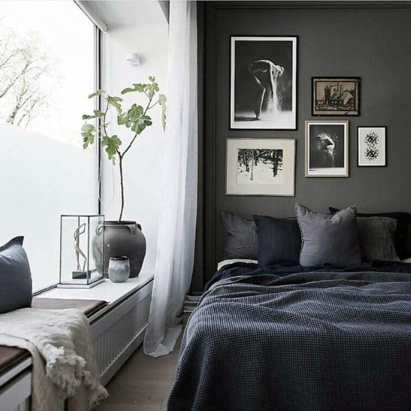 dark small master bedroom with window bay seating 