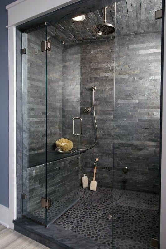 large natural stone bathroom with seat