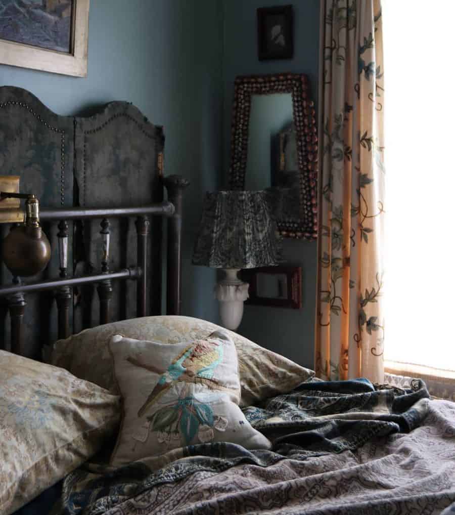 dark vintage bedroom with cast iron bed