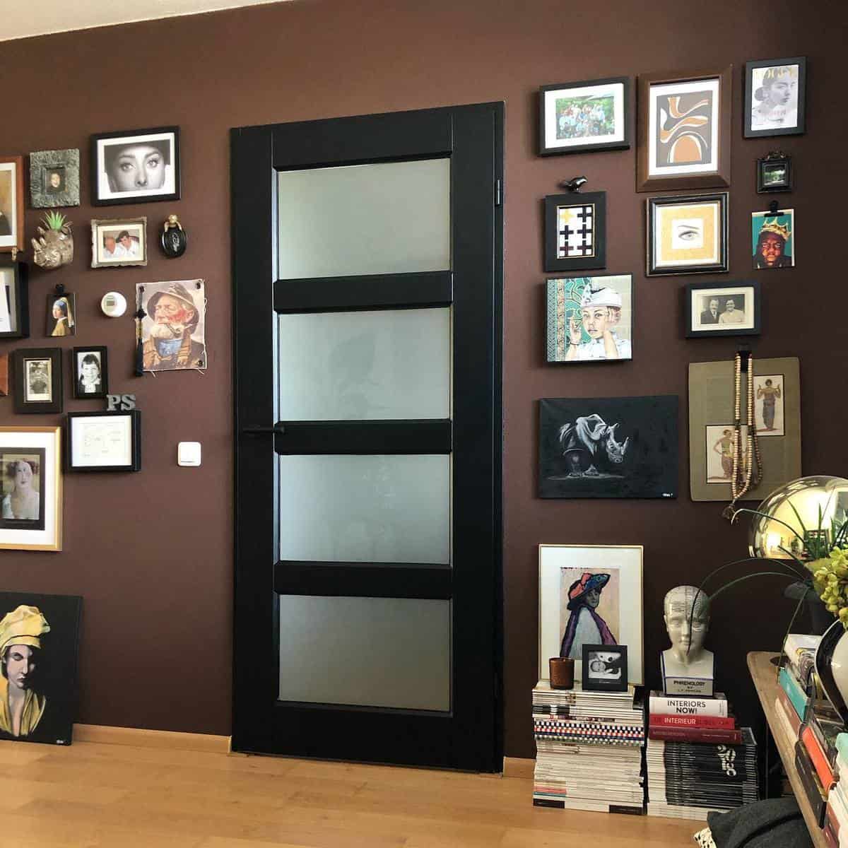 brown accent wall framed pictures black accent door