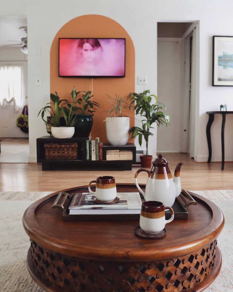 boho living room wall mounted tv potted plants teapot