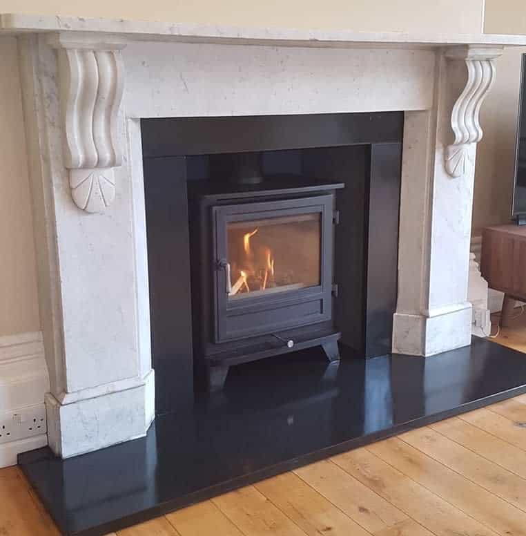 simple white marble fireplace black base 