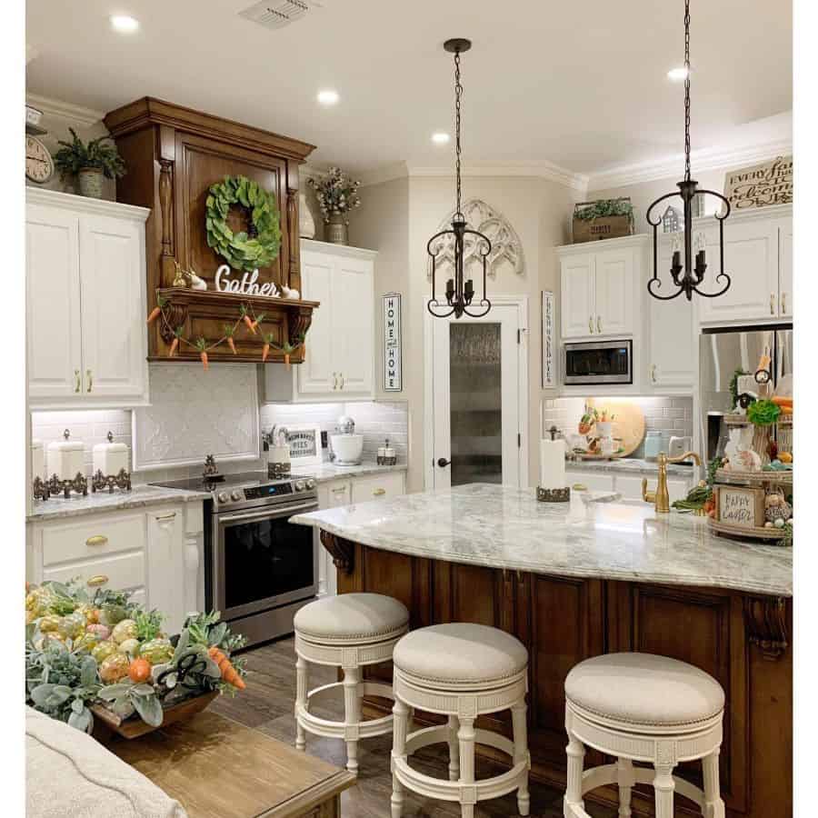 rustic farmhouse kitchen white cabinets stools flowers 