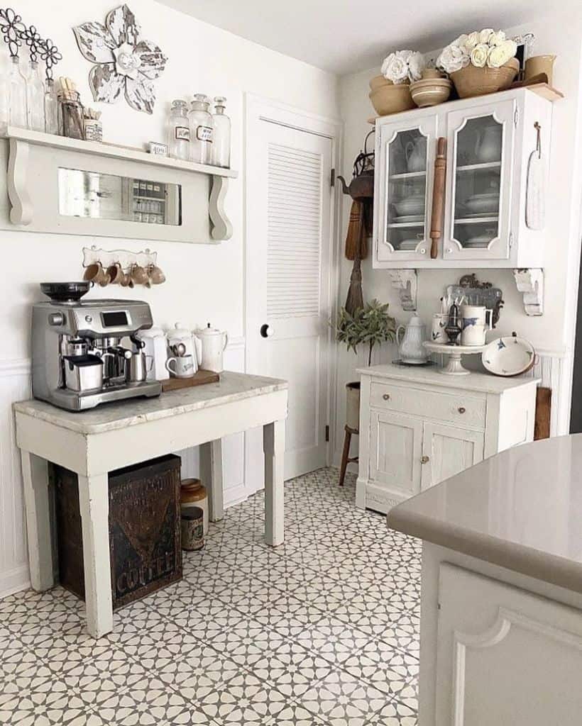 small country style kitchen white cabinets coffee machine pattern tile floor