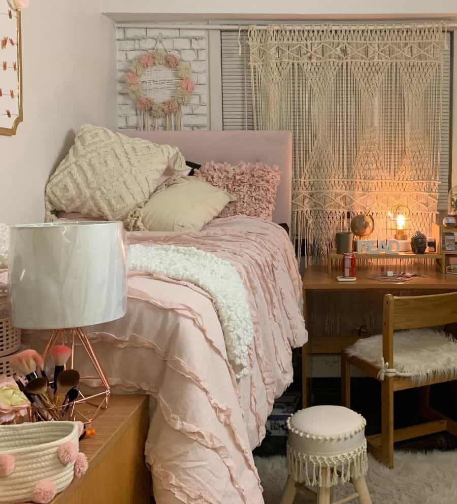 boho bedroom wood desk and chair pink bedspread 