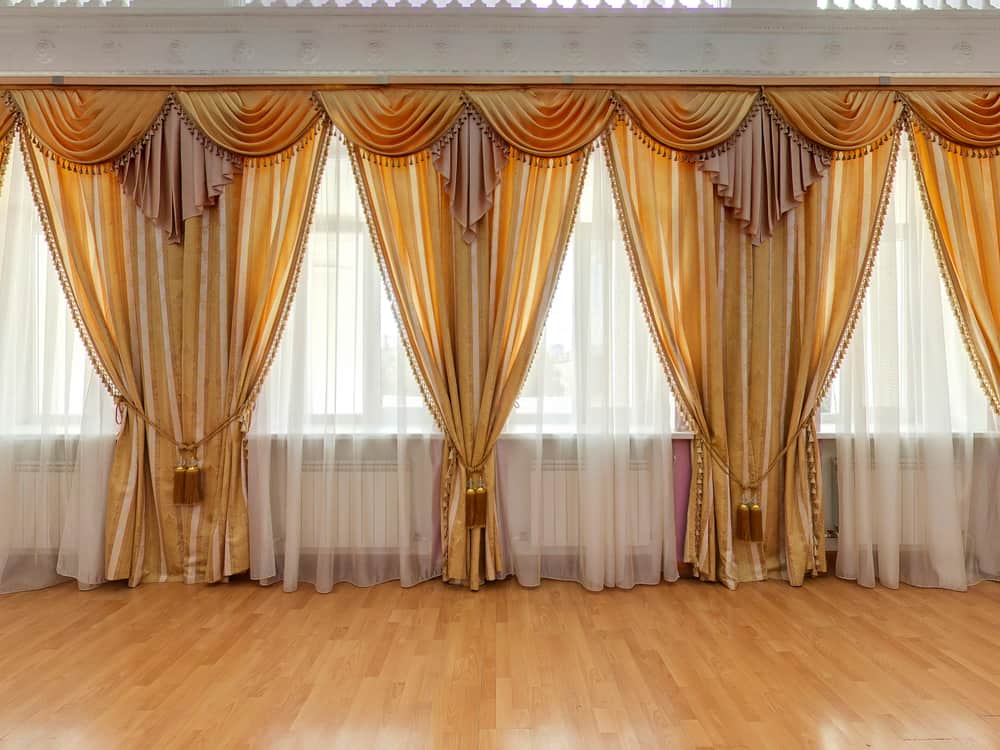 elegant yellow curtains large living space vinyl wood flooring 
