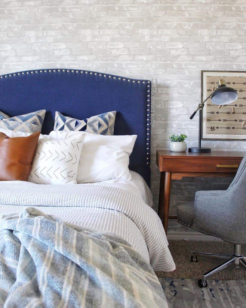 white brick wallpaper blue bed wood desk