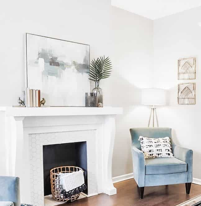 white faux fireplace blue accent chair 