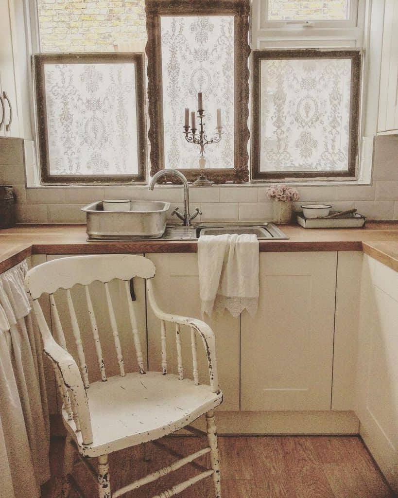 french country chic kitchen white cabinets vintage chair candlestick 
