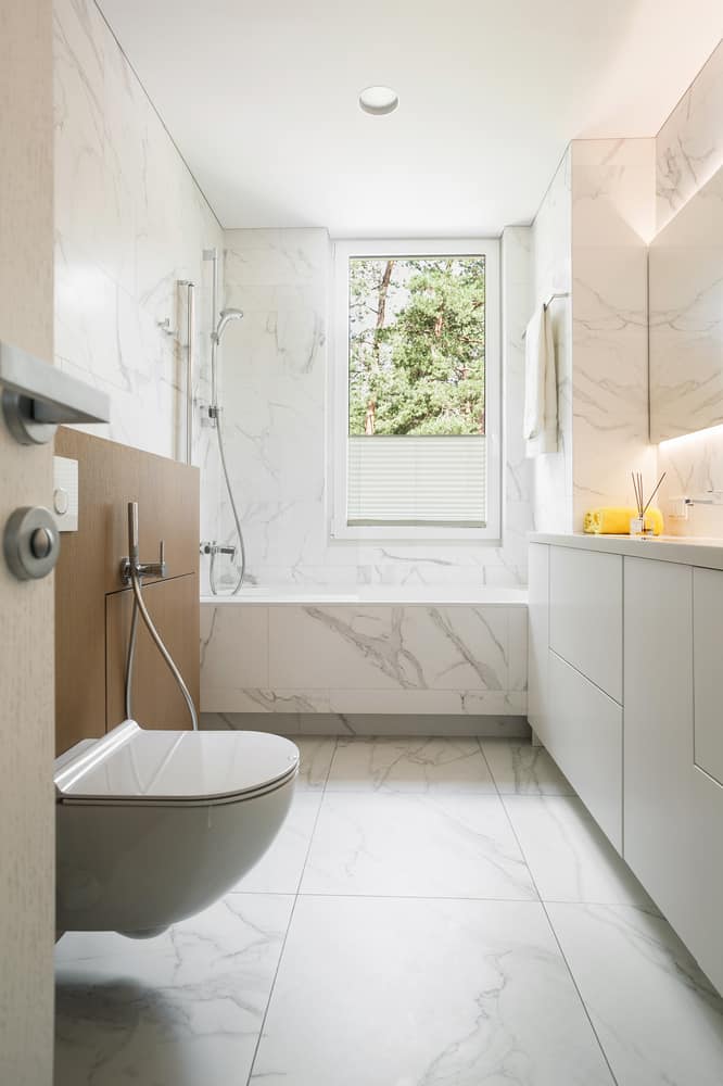 minimalist small master bathroom with marble walls and flooring 
